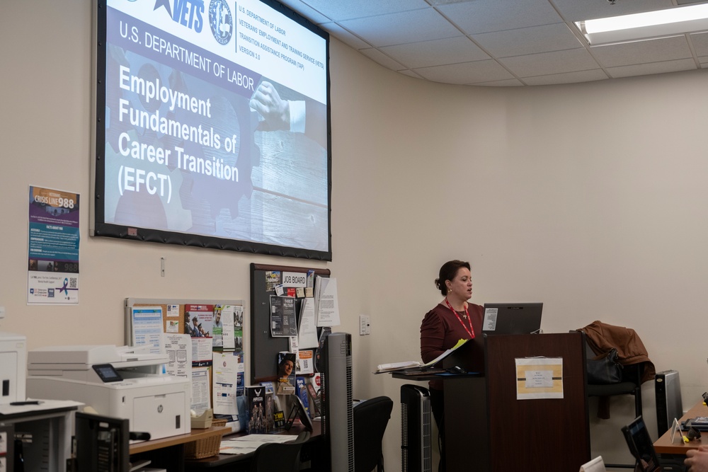 A realistic transition assistance classroom scene with a facilitator presenting employment fundamentals.